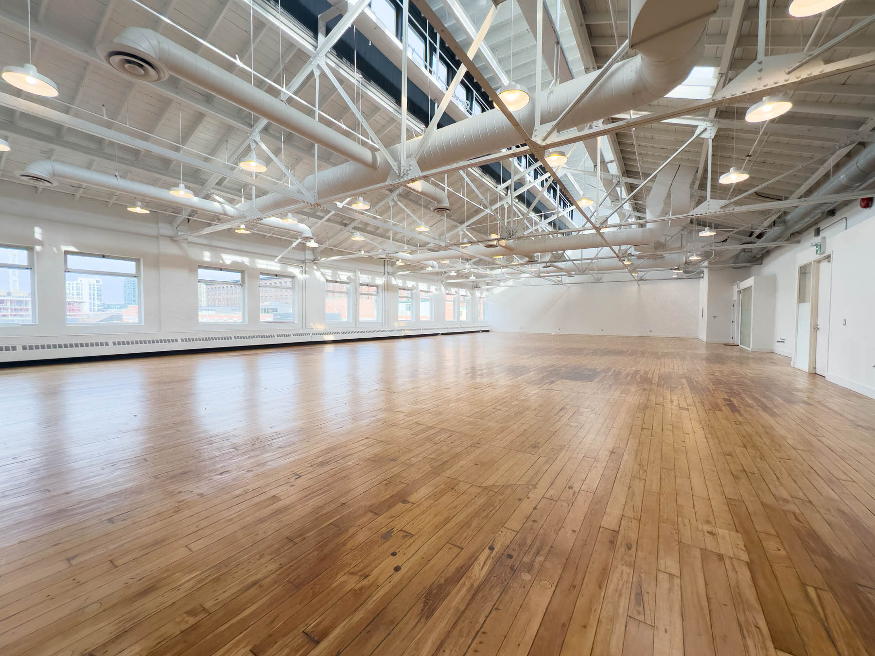 A full top floor beneath the white truss roof